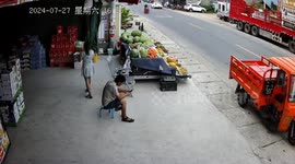 Motorcycle crash topples fruit stand but vendor escapes unharmed