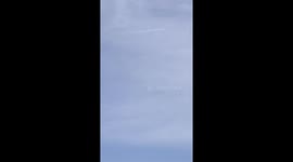 A blue cigar-shaped UFO with a contrail behind it was spotted in Taiwan on the morning of August 4, 2024.