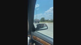 Hanging on in the Back of a Pickup Truck