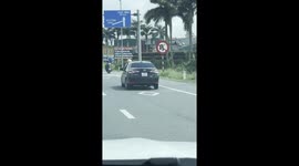 Police Officer Rides On Car Hood