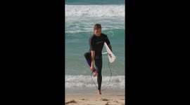 Surfer Stumbles and Snaps Board