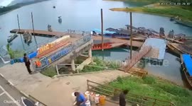 Minivan crashes through barrier and plunges into dam