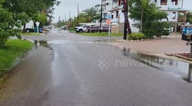 Cleanup begins on Bradenton Beach, Florida amid gusty winds after storm Debby