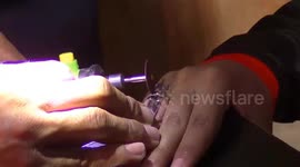 Dramatic officers evacuate rings from citizens' finger in indonesia