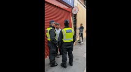 Police look on.as.shops.are.boareded up ahead of planed Farr right and counter protests in Waltham forrrst London