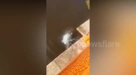 Brave policeman jumps 130ft off bridge to save drowning woman