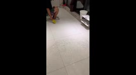 Resident humorously 'rows' water out of flooded home in China