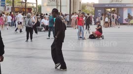 Viral dancer Salif Gueye seen performing next to Champs-Elysees