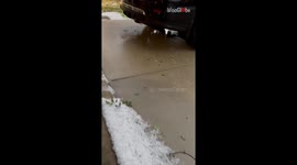 Vehicles and garage doors dented following severe hailstorm in Calgary