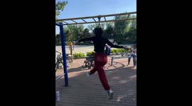Bizarre moment woman hangs on monkey bars to spin repeatedly