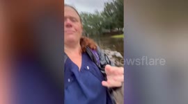 Nurse forced to walk through chest-height water left behind by Hurricane Debby