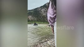 Bulldozer rescues four stranded passengers from rapids