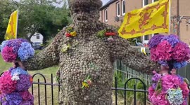 Man covered in over 13,000 sticky plant heads as part of 900-year-old tradition