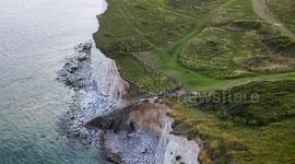 The Steps at Hope Gap giving access to the beach have become unusable due to erosion by the sea under cutting the cliff as the edge of the South Downs National Park loses a metre of coastline every year. Cuckmere Haven, East Sussex, UK