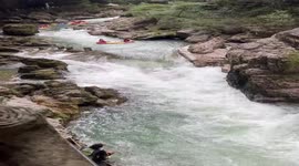 Hero lifeguard leaps onto capsized raft to save riders