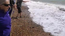 UK: Today's Brighton march ended down on the beach where people scattered flowers into the sea as a mark of remembrance for the tens of thousands who have been killed and injured in the Gaza Genocide
