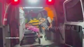 Palestine: The work of the Palestine Red Crescent ambulance teams in retrieving the bodies of martyrs and the wounded following the Israeli occupation's bombing