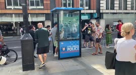 Crowds gather to see the new Banksy piece in the City of London