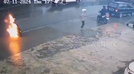 The motorbike rider was very shocked, the motorbike he was riding caught fire badly