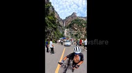 Tourists flee in panic as rocks plummet from waterfall in China