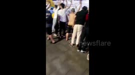 Heroic locals lift shop sign to rescue pedestrian trapped underneath in China