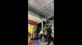 Talented street performer balances bike on his MOUTH