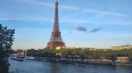 View of the Eiffel Tower from the train crossing the Pont de Bir Hakeim bridge