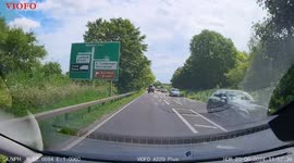 Car kicks up cloud of dust after drifting off highway in Norfolk, UK