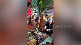 Villager marries 'crocodile demon' in river ceremony in Indonesia