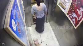 Pet dog narrowly avoids injured when lead gets stuck in lift door