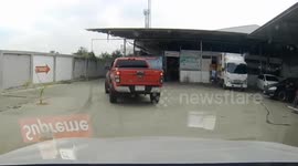 Cat stuck in back wheel of pickup truck