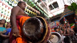 Hindu Devottees show their extreme devotion by piercing,hooking their body and hanging from vehicles