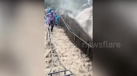 Heavy rainfall turns steps at beauty spot into dangerous waterfall