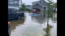 Neighbors Make the Most of Flooded Street