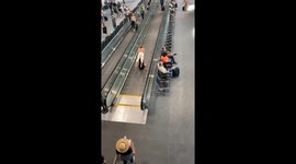 Travelers Have Fun on Moving Walkway at Denver Airport