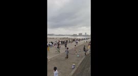 Tidal bore crashes into shore caused by approaching typhoon