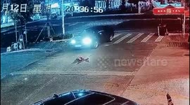 Chinese boy lying in busy road narrowly escapes serious injury as car’s tyre grazes his head