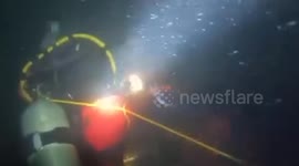 Divers conduct initial siphoning test on sunken tanker in the Philippines