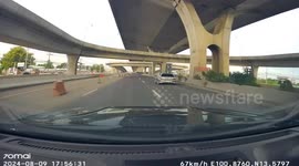 Loose hub cap flies across motorway and hits car bonnet