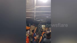 Firefighters search and pull large python from family's ceiling