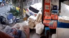 Chinese woman on scooter narrowly escapes out-of-control bus crash