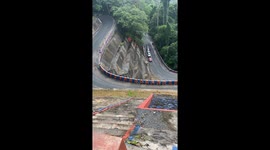 Fancy driving on this? Cars negotiate winding mountain road in the Philippines