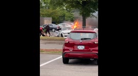 People Pull Passengers Out of Burning Car