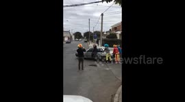 Argentina: A group of clowns helps a car in trouble in Argentina