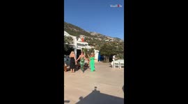 Women's cool outfit check interrupted by clumsy mate's epic fail moment