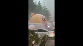Large inflatable egg blown over during storm in China