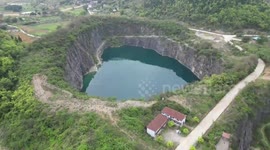 Abandoned mine pit in China becomes hot spot for cooling off in summer heat