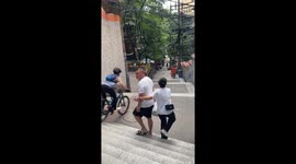 Bicyclist loses balance and falls down steps in Chongqing, China