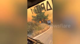 Dramatic footage shows firefighters battling massive wildfires near Athens