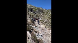 Dodging hikers on a scenic hill in Chamonix during romantic date